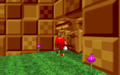 Knuckles destroying a breakable wall just by walking into it.